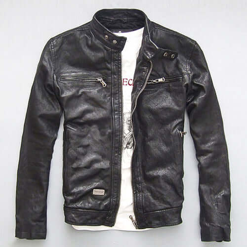 Men's black slim-fit goatskin leather motorcycle jacket with zipper decoration on white background.