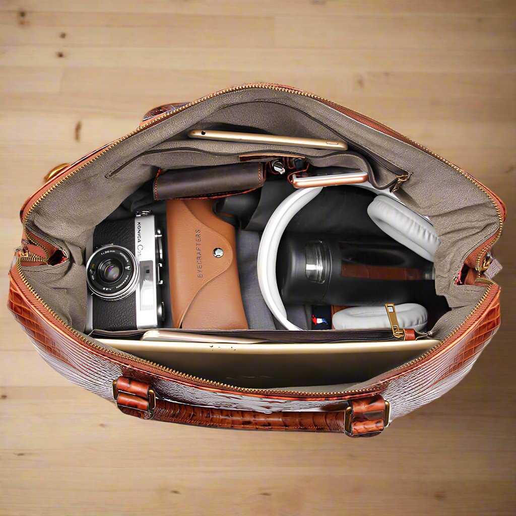 Brown Croc Print Real Leather Duffle Bag interior showing camera, laptop, and other travel essentials