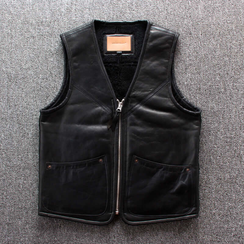 Lamb wool warm leather vest with zipper closure and multiple pockets, no collar design, and slim-fit cardigan style on grey background.