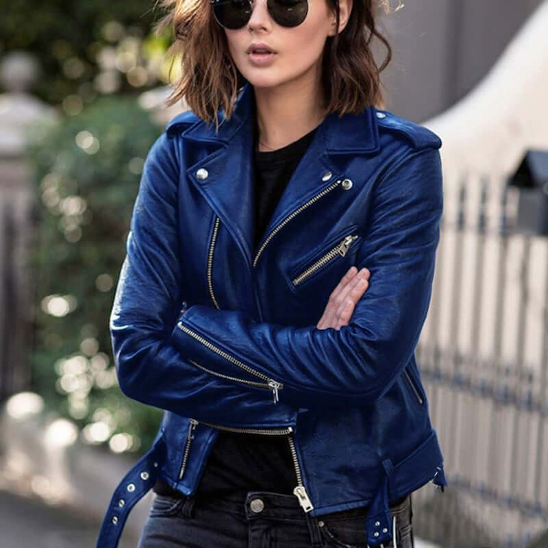 Street style zip imitation leather jacket with lapel collar in blue worn by a woman with sunglasses, ideal for an edgy look