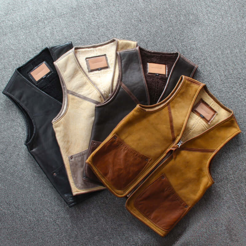 Lamb wool warm leather vests with zipper closure and pockets in various colors laid flat.