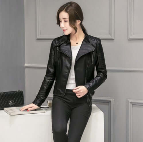 Woman wearing Slim Jacket Motorcycle Leather Women Short in black, stylish short imitation leather jacket with stand-up collar, perfect for any occasion