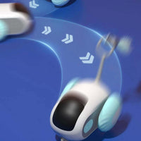 Remote control interactive cat car toy with blue wheels in action, showing fast and unpredictable movements on a blue background.