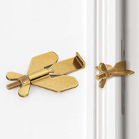 Portable hotel door lock for self-defense and security safety in a gold butterfly design.