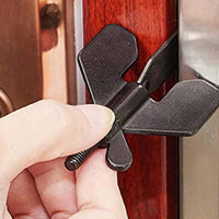 Portable hotel door lock being installed on a wooden door for self-defense and travel security.