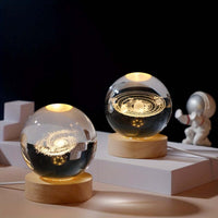 3D Solar System Crystal Ball Night Light vividly displaying the universe in laser-engraved K9 crystal with warm illumination, sparking wonder.