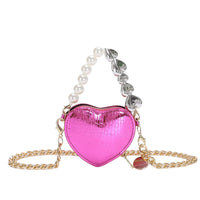 Mini Love-Shape Pearls Handbag in vibrant pink, featuring a heart design with pearl and chain strap, perfect blend of playful style and functionality.