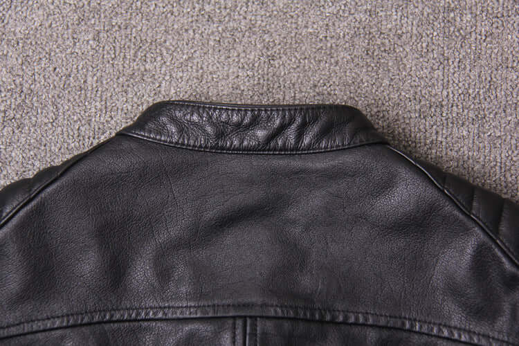 Back view of a black washed genuine leather jacket with a short stand-up collar, suitable for men in spring and autumn seasons.