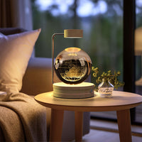 Crystal Ball Cosmic Dinosaur Indoor Night Light on bedside table with USB Power, adding a warm and magical glow to the room.