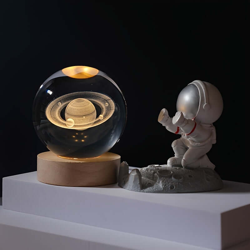 3D Solar System Crystal Ball Night Light with an astronaut figurine, perfect for sparking your child's curiosity about space.