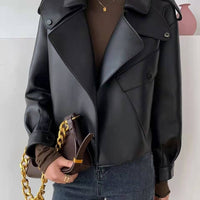 Woman wearing Female Sheepskin Loose Biker Jacket in black with gold chain handbag