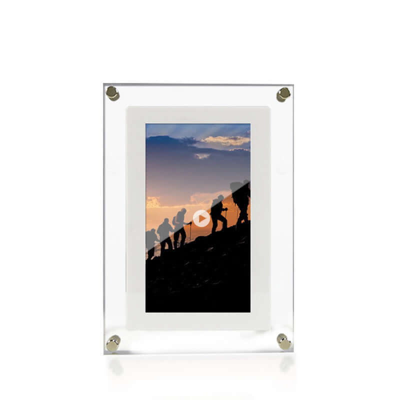 Digital picture frame displaying a hiking video at sunset with sleek acrylic design.