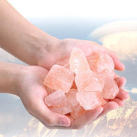 hand holding Crystal Natural Himalayan Salt